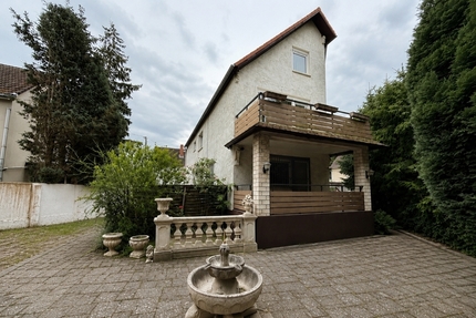 Vielseitiges Wohn- und Geschäftshaus mit großem Grundstück und Entwicklungspotenzial in Frankfurt-Bonnames - Haus Frankfurt am Main Bonames | Angebot:26912907