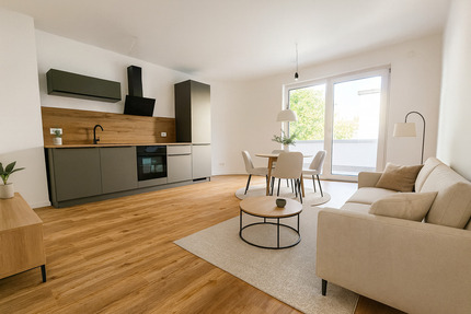 NEUBAU-ERSTBEZUG: 2-Zimmerwohnung mit Balkon, hochwertiger Einbauküche und Tiefgaragen-Stellplatz 2 zimmer